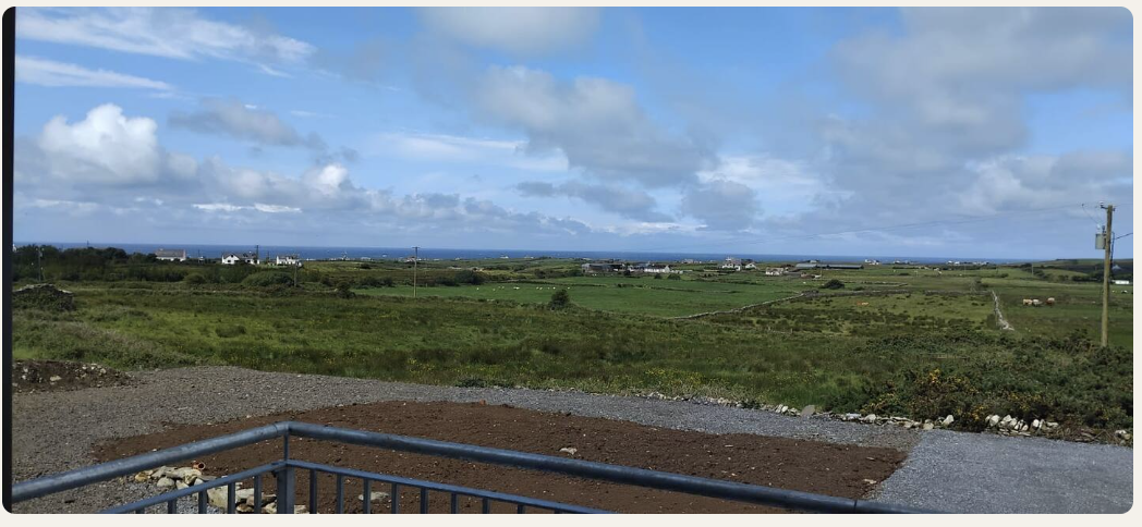 Panoramic view from the balcony across countryside and mountains