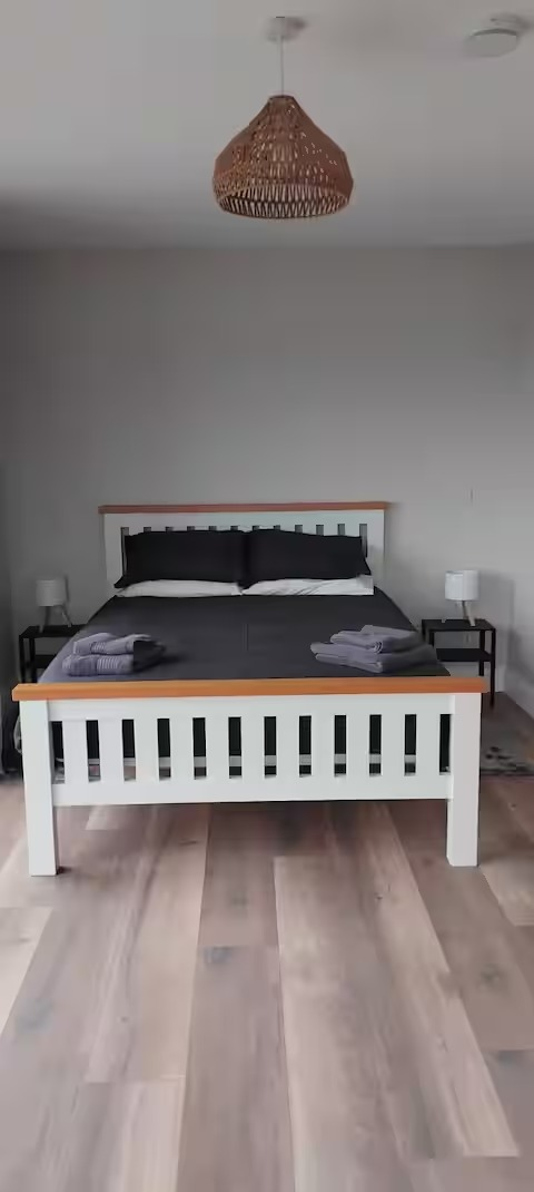 Master bedroom with made bed